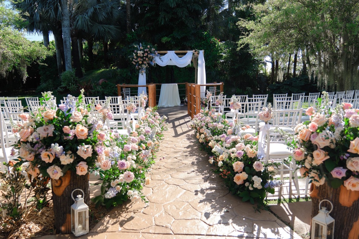 Romantic blush and ivory floral ceremony aisle designed by La Fleur de Liz